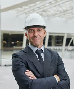 confident-businessman-at-construction-site-1.jpg